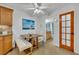 Bright kitchen with breakfast nook, wood cabinets, and tiled floor at 116 Cedar Dunes Dr, New Smyrna Beach, FL 32169