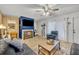 Spacious living area with fireplace and plenty of natural light at 116 Cedar Dunes Dr, New Smyrna Beach, FL 32169