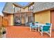 Charming patio area with a screened-in porch, perfect for outdoor dining and relaxation at 116 Cedar Dunes Dr, New Smyrna Beach, FL 32169