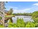 Peaceful waterfront view with lush landscaping at 116 Cedar Dunes Dr, New Smyrna Beach, FL 32169