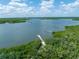 Scenic view of calm waters and lush mangroves at 116 Cedar Dunes Dr, New Smyrna Beach, FL 32169