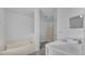 Clean bathroom with a bathtub, shower, and white vanity at 230 Oak Branch Dr, Edgewater, FL 32141