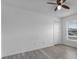 Spacious bedroom with ceiling fan and window at 230 Oak Branch Dr, Edgewater, FL 32141