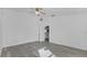 Bright bedroom with gray flooring and a ceiling fan at 230 Oak Branch Dr, Edgewater, FL 32141