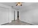 Bright bedroom with ceiling fan and double door closet at 230 Oak Branch Dr, Edgewater, FL 32141