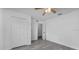Bedroom with ceiling fan and double door closet at 230 Oak Branch Dr, Edgewater, FL 32141