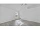 Spacious bedroom with gray flooring and a view of the backyard at 230 Oak Branch Dr, Edgewater, FL 32141