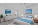 Main bedroom with light walls, ceiling fan, and large window at 230 Oak Branch Dr, Edgewater, FL 32141