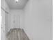 Bright and airy entryway with light gray vinyl plank flooring at 230 Oak Branch Dr, Edgewater, FL 32141