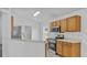 Kitchen features a breakfast bar and modern appliances at 230 Oak Branch Dr, Edgewater, FL 32141