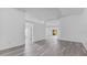Open concept living area with gray vinyl flooring and neutral wall colors at 230 Oak Branch Dr, Edgewater, FL 32141