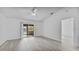 Living room with sliding doors leading to a screened porch at 230 Oak Branch Dr, Edgewater, FL 32141