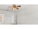 Spacious bedroom with ceiling fan and access to bathroom at 3810 Wind Dancer Cir, Saint Cloud, FL 34772