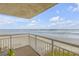 Enjoy breathtaking ocean views from this condo's private balcony with comfortable seating at 4811 Saxon Dr # C102, New Smyrna Beach, FL 32169