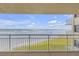 Balcony showcasing a stunning ocean view with white railings and sunny skies at 4811 Saxon Dr # C102, New Smyrna Beach, FL 32169