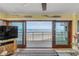Balcony view of the ocean, beach, and a nearby building from a condo at 4811 Saxon Dr # C102, New Smyrna Beach, FL 32169