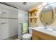 Cozy bathroom featuring an updated shower and simple vanity with sink at 4811 Saxon Dr # C102, New Smyrna Beach, FL 32169