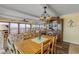 Dining room area with a view to the beach, a wooden table, and a hutch at 4811 Saxon Dr # C102, New Smyrna Beach, FL 32169