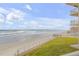 Beautiful view of the beach from the building's lawn at 4811 Saxon Dr # C102, New Smyrna Beach, FL 32169