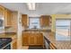 Well-lit kitchen features granite countertops, stainless steel appliances, and ocean view at 4811 Saxon Dr # C102, New Smyrna Beach, FL 32169