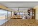 Inviting living room showcasing ocean views, wood dining set and cabinets at 4811 Saxon Dr # C102, New Smyrna Beach, FL 32169