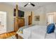 Bedroom featuring a four poster bed, hardwood flooring, and integrated closet storage at 4946 Halifax Dr, Port Orange, FL 32127