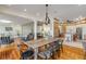 Open-concept dining room with hardwood floors adjacent to the kitchen and living spaces at 4946 Halifax Dr, Port Orange, FL 32127