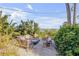 Cozy outdoor fire pit area with comfortable seating and lush foliage at 4946 Halifax Dr, Port Orange, FL 32127