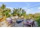 Outdoor lounge with a stylish fire pit and comfortable seating at 4946 Halifax Dr, Port Orange, FL 32127