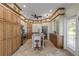 Expansive kitchen featuring custom cabinetry, an island, and stainless steel appliances at 4946 Halifax Dr, Port Orange, FL 32127