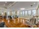Bright living room with hardwood floors, large windows, and views of the water at 4946 Halifax Dr, Port Orange, FL 32127