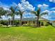 Large grassy backyard with screened pool at 6812 Stoneheath Ln, Port Orange, FL 32128