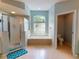 Spacious bathroom with soaking tub, separate shower, and double vanity at 6812 Stoneheath Ln, Port Orange, FL 32128