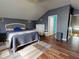 Spacious bedroom with a bed, dresser, and ensuite bathroom at 6812 Stoneheath Ln, Port Orange, FL 32128