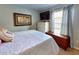 Cozy bedroom with large bed, dresser, and window at 6812 Stoneheath Ln, Port Orange, FL 32128
