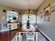 Bright dining room with hardwood floors and farmhouse style decor at 6812 Stoneheath Ln, Port Orange, FL 32128