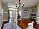 Elegant dining room with hardwood floors and chandelier at 6812 Stoneheath Ln, Port Orange, FL 32128