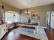 Bright dining room with hardwood floors and farmhouse style decor at 6812 Stoneheath Ln, Port Orange, FL 32128