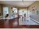 Bright dining room with hardwood floors and farmhouse style decor at 6812 Stoneheath Ln, Port Orange, FL 32128