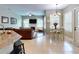 Open concept living and dining area with hardwood floors and fireplace at 6812 Stoneheath Ln, Port Orange, FL 32128