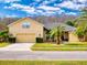 Beautiful two-story home with landscaped yard and attached garage at 6812 Stoneheath Ln, Port Orange, FL 32128