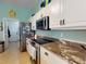 Kitchen boasts granite countertops and stainless steel appliances at 6812 Stoneheath Ln, Port Orange, FL 32128