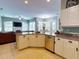 Open kitchen with granite island and stainless steel appliances at 6812 Stoneheath Ln, Port Orange, FL 32128