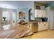 Island kitchen with granite countertops and stainless steel appliances at 6812 Stoneheath Ln, Port Orange, FL 32128
