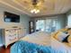 Bright bedroom with king bed and sliding doors to lanai at 6812 Stoneheath Ln, Port Orange, FL 32128