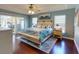 Main bedroom with king bed and access to the backyard at 6812 Stoneheath Ln, Port Orange, FL 32128