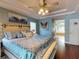 Large main bedroom with king-size bed and ensuite bathroom at 6812 Stoneheath Ln, Port Orange, FL 32128