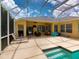Spacious pool patio with seating and pool access at 6812 Stoneheath Ln, Port Orange, FL 32128