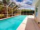 Refreshing screened pool with ample pool deck at 6812 Stoneheath Ln, Port Orange, FL 32128