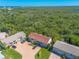 This high aerial shot offers a detailed look at the property, mature landscaping, and surrounding neighborhood at 731 Laurel Bay Cir, New Smyrna Beach, FL 32169